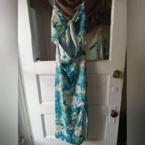 Strappy, sexy summer maxi dress. Cut-out front, rouged back, mid-thigh slit.